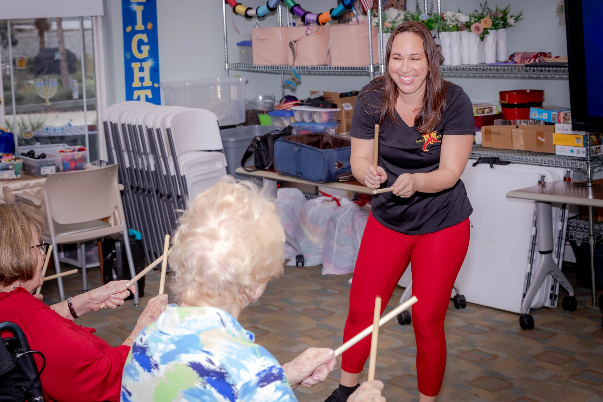 An InstruMix instructor leading a rhythm sticks routine